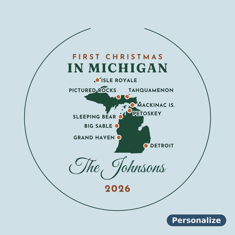 May include: A circular ornament featuring a dark green map of Michigan on a light blue background. Text reads FIRST CHRISTMAS IN MICHIGAN, The Johnsons, and 2026. Orange dots mark locations including Detroit, Grand Haven, and Isle Royale.