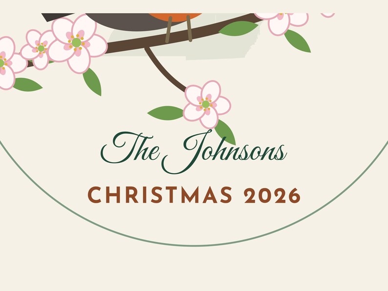 May include: A circular ornament featuring a brown bird perched on a branch with pink blossoms and green leaves. The text reads The Johnsons in dark green script and CHRISTMAS 2026 in brown block letters on a cream background.