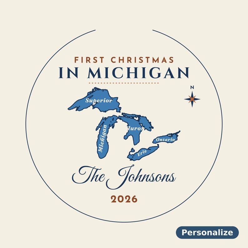 May include: A circular ornament design featuring the text FIRST CHRISTMAS IN MICHIGAN in blue and brown. A blue map of the Great Lakes is centered with labels for Superior, Michigan, Huron, Erie, and Ontario. Below is The Johnsons 2026.