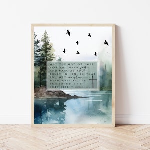 May include: A watercolor painting of a forest scene with a lake and birds flying overhead. The painting features a quote from Romans 15:13: "May the God of hope fill you with joy and peace as you trust in him, so that you may overflow with hope by the power of the Holy Spirit."