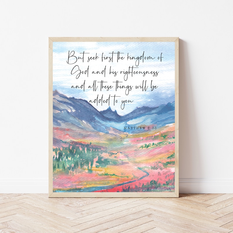 May include: A watercolor painting of a mountain landscape with a quote from the Bible: "But seek first the kingdom of God and his righteousness and all these things will be added to you." Matthew 6:33