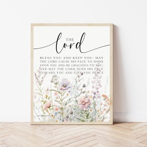 May include: A framed print with a floral design and a quote from the Bible: "The Lord bless you and keep you; may the Lord cause his face to shine upon you and be gracious to you; and may the Lord turn his face toward you and give you peace."  Numbers 6:24-26