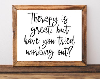 May include: A framed print with a white background and black text that reads "Therapy is great, but have you tried working out?"