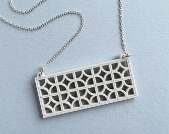 Laser cut Miniature Breezeblock Necklace by Tiny Scenic / matt Perspex and sterling silver