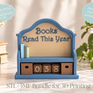 May include: A blue 3D printed shelf with a beige back panel featuring the text Books Read This Year. It includes three small vertical books, two brown storage bins, and three brown cubes displaying the numbers 0, 3, and 8.