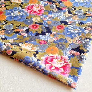 May include: Blue fabric with a floral pattern featuring pink, white, and gold flowers. The fabric has a subtle shimmer and a Japanese-inspired design.