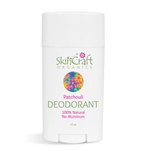May include: White deodorant stick with the text "Patchouli DEODORANT" and "100% Natural No Aluminum". The product has a colorful floral design and the brand name "SkinCraft Organics". The deodorant is 2.5 oz.