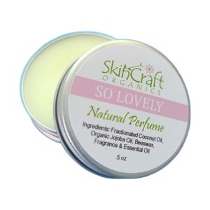 May include: A small, open, silver tin of "SO LOVELY Natural Perfume" by SkinCraft Organics. The label includes ingredients: Fractionated Coconut Oil, Organic Jojoba Oil, Beeswax, Fragrance & Essential Oil. The perfume is .5 oz.