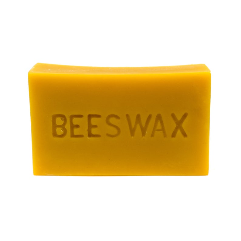May include: A block of yellow beeswax with the word "BEESWAX" embossed on the front.