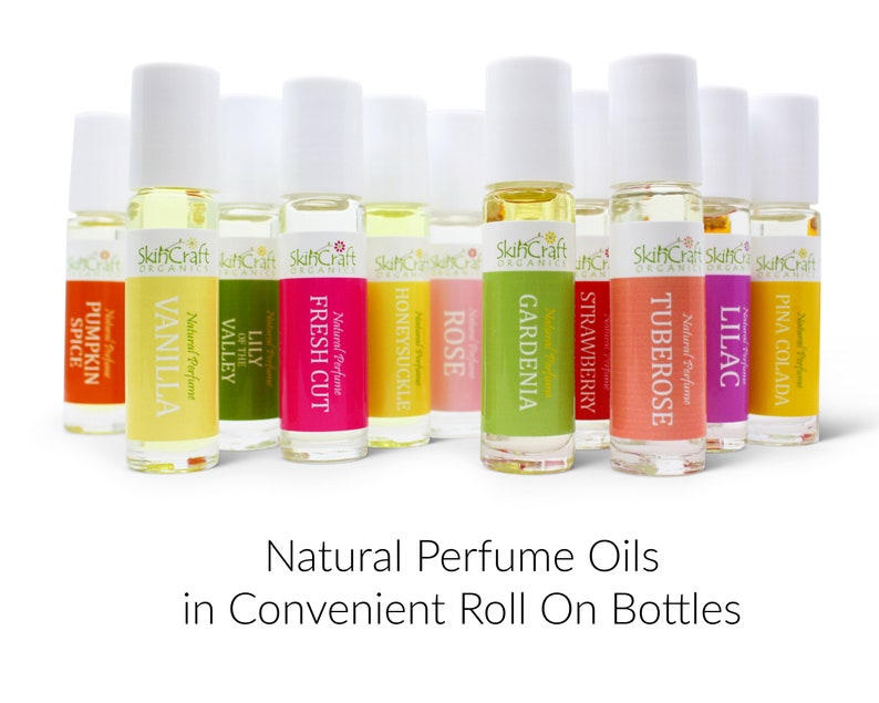 May include: A set of 10 natural perfume oils in roll-on bottles. The bottles are labeled with the scents: Pumpkin Spice, Vanilla, Lily of the Valley, Fresh Cut, Honeysuckle, Rose, Gardenia, Strawberry, Tuberose, Lilac, and Pina Colada.