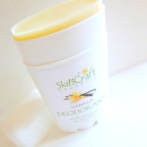 May include: A white deodorant stick with a yellow label that says "SkinCraft Organics Vanilla Deodorant 100% All Natural No Aluminum".