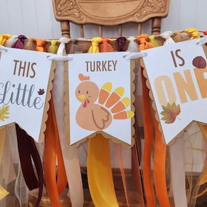 This little turkey is one high chair banner. Thanksgiving birthday party decorations.