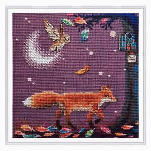 May include: A purple cross-stitch embroidery depicting a fox walking through a woodland scene with a crescent moon, an owl, and falling leaves.