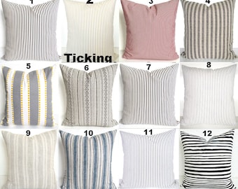 May include: Twelve different striped pillow covers with various colors and patterns. The pillow covers are numbered 1 through 12. The word "Ticking" is printed in the center of the image.