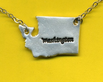 Handcrafted from recycled silver, this Washington State pendant hangs from a sterling silver chain