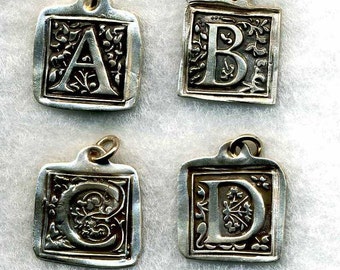 Initials with a filigree background