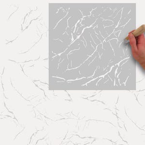 Peut inclure: Un pochoir gris avec un motif de marbre blanc. Le pochoir est utilisé pour créer un effet de marbre sur une surface.