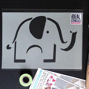May include: A gray stencil of a simple elephant design. The stencil is made of a durable material and is perfect for creating unique wall art or home decor.