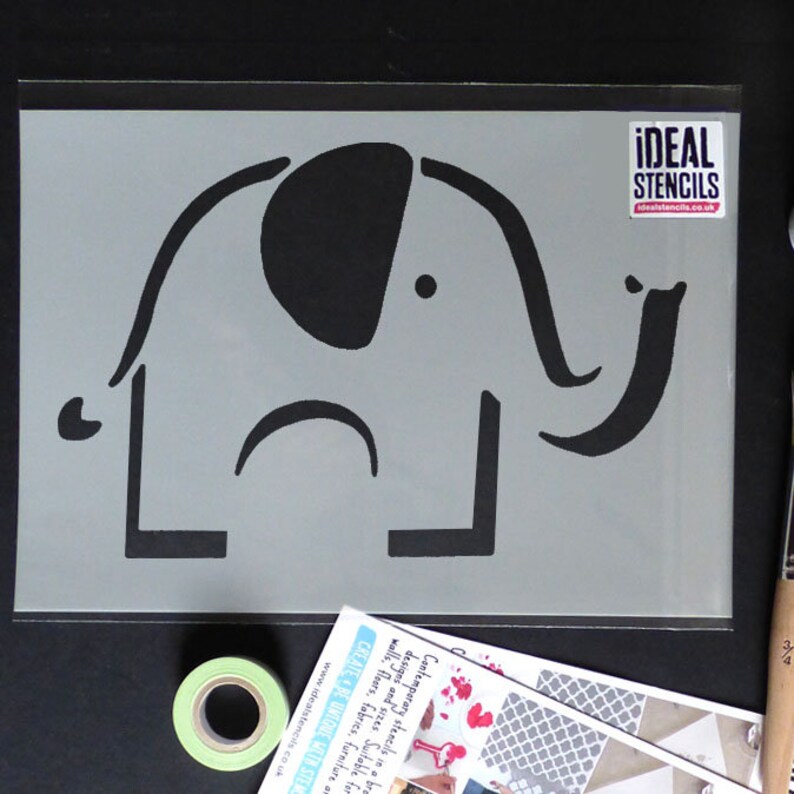 May include: A gray stencil of a simple elephant design. The stencil is made of a durable material and is perfect for creating unique wall art or home decor.