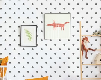 May include: A white wall with a gray polka dot pattern. There are two framed pictures on the wall, one with a fern and the other with a red fox illustration. A wooden ladder with a stuffed fox toy is leaning against the wall.