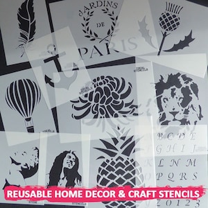 May include: A set of reusable stencils for home decor and crafts. The stencils feature a variety of designs, including a pineapple, a lion, a flower, an anchor, a hot air balloon, a feather, a thistle, and the words "Jardins de Paris".