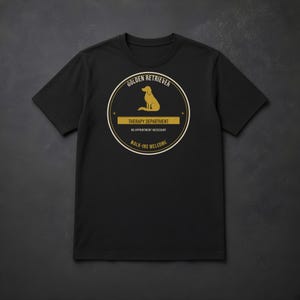 K&ouml;nnte beinhalten: Ein schwarzes T-Shirt mit kurzen &Auml;rmeln und einem kreisf&ouml;rmigen Aufdruck, der die goldene Silhouette eines Hundes zeigt. Der Text lautet: GOLDEN RETRIEVER, THERAPY DEPARTMENT, NO APPOINTMENT NECESSARY und WALK-INS WELCOME.