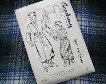 May include: A vintage sewing pattern for a robe, featuring two illustrations of children wearing robes. The pattern is labeled "Academy Pattern" and "2144 Price 1/9 Size 8 YRS".