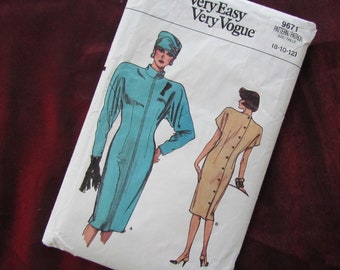 May include: A sewing pattern for two dresses, one in teal and one in beige. The pattern is called "Very Easy Very Vogue" and the pattern number is 9671. The size range is 8-10-12.