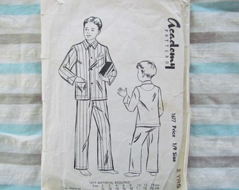 May include: A vintage sewing pattern for a child's pajamas. The pattern is from Academy Pattern and is for size 2 years. The pattern includes instructions for making a striped pajama top and pants.