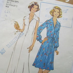 May include: Vintage sewing pattern featuring two dress designs. One dress is white with a button-down front, the other is blue with a floral pattern and a tie waist. The pattern includes bust measurements of 36" and 38".