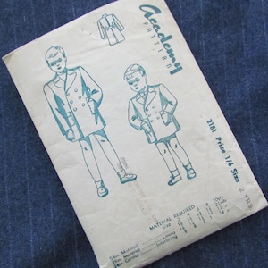 May include: A vintage sewing pattern for a child's double-breasted coat. The pattern is from Academy Pattern and is for size 2 years. The pattern includes instructions for making the coat from 54-inch, 39-inch, and 24-inch materials. The pattern also includes instructions for making a lining and interlining.