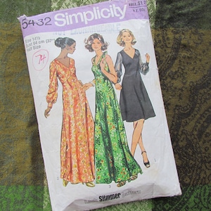 May include: Vintage Simplicity sewing pattern 5432 featuring three long dresses. The pattern includes a size 14 1/2 with a bust of 37 inches (94 cm). The pattern envelope is white with illustrations of the dresses in orange, green, and black.