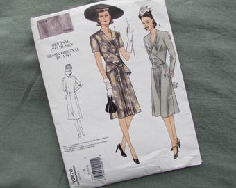 May include: Vintage Vogue sewing pattern from 1943. The pattern features illustrations of two women in dresses, one with a floral print and the other in solid gray. The pattern's title is printed in both English and French.