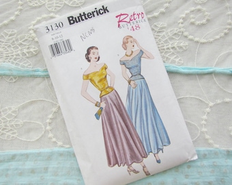 May include: Vintage sewing pattern for a dress with a fitted bodice and a full skirt. The pattern is from Butterick, Retro '48, and is size 8-10-12. The pattern features two models wearing the dress in different colors.