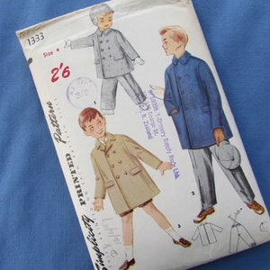 May include: Vintage Simplicity sewing pattern for a boy's coat. The pattern is for size 4 and includes instructions for making a double-breasted coat with a collar and pockets. The pattern is printed on a white background with black text.