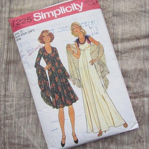 May include: A vintage Simplicity sewing pattern, size 12, with illustrations of two dresses. The envelope is white with red text and handwritten notes. Bust size is 87cm.