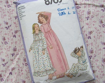 May include: A sewing pattern for two sizes of nightgowns and pajamas. The pattern includes instructions for making a long-sleeved nightgown with a floral print, a long-sleeved nightgown with a solid pink color, and pajamas with a floral print. The pattern also includes measurements for the sleeves and pants.