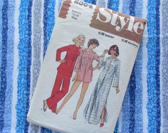 May include: A vintage sewing pattern for a pajama set. The pattern is for sizes 14-16 and is titled "Style". The pattern shows three women wearing different versions of the pajama set. The set includes a long-sleeved top and pants. The pattern is printed on white paper with brown text.