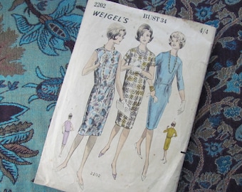 May include: Vintage sewing pattern for a dress, featuring three women wearing different styles of dresses. The pattern is labeled "Weigel's" and "Bust 34".
