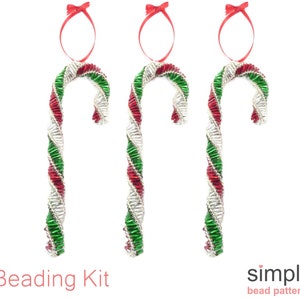 May include: A beading kit to make three candy cane ornaments. The candy canes are red, green, and silver beads.