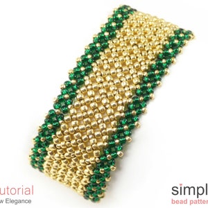 May include: A gold and green beaded bracelet with a chevron pattern. The bracelet is made with small, round beads and has a simple, elegant design.