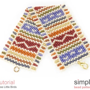 May include: A colourful beaded bracelet with a geometric pattern in shades of red, orange, yellow, green, blue, and white. The bracelet has a gold clasp.