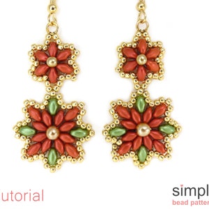 May include: A pair of gold earrings with three red and green beaded flower designs. The earrings are hanging from gold hooks.