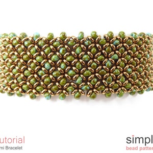 May include: A green and gold beaded bracelet with a woven pattern. The bracelet is made with small seed beads and is a demi bracelet style.