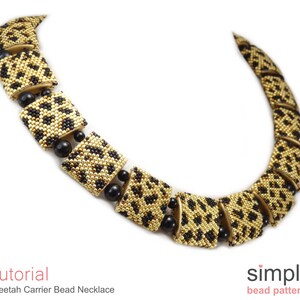 May include: A gold and black beaded necklace with a cheetah print pattern. The necklace is made of small square beads and is designed to look like a series of connected squares. The necklace is called "Cheetah Carrier Bead Necklace".