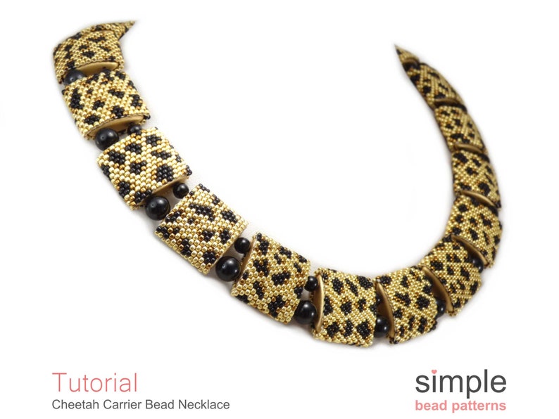 May include: A gold and black beaded necklace with a cheetah print pattern. The necklace is made of small square beads and is designed to look like a series of connected squares. The necklace is called "Cheetah Carrier Bead Necklace".