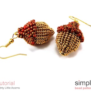 May include: A pair of gold and red beaded earrings with a simple design. The earrings are made with small seed beads and have a teardrop shape. The earrings are hanging from gold hooks.