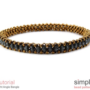 May include: A gold and grey beaded bangle bracelet. The bracelet is made with small, round beads in a right angle weave pattern. The bracelet is a simple design and would be a great addition to any jewellery collection.