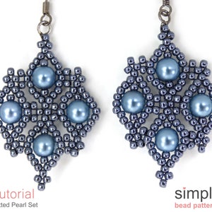 May include: A pair of blue beaded earrings with a snowflake design and pearl accents. The earrings are made with small seed beads and larger pearls. The earrings are hanging from silver ear wires.