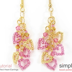 May include: Gold and pink beaded heart earrings with a dangling chain. The earrings are made with small beads and have a simple design.